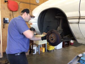 Rich, a technician at Scofield Automotive repair in Roseburg and Green, OR repairing brakes