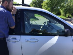 Image of Jamin Scofield of Scofield Automotive unlocking a car